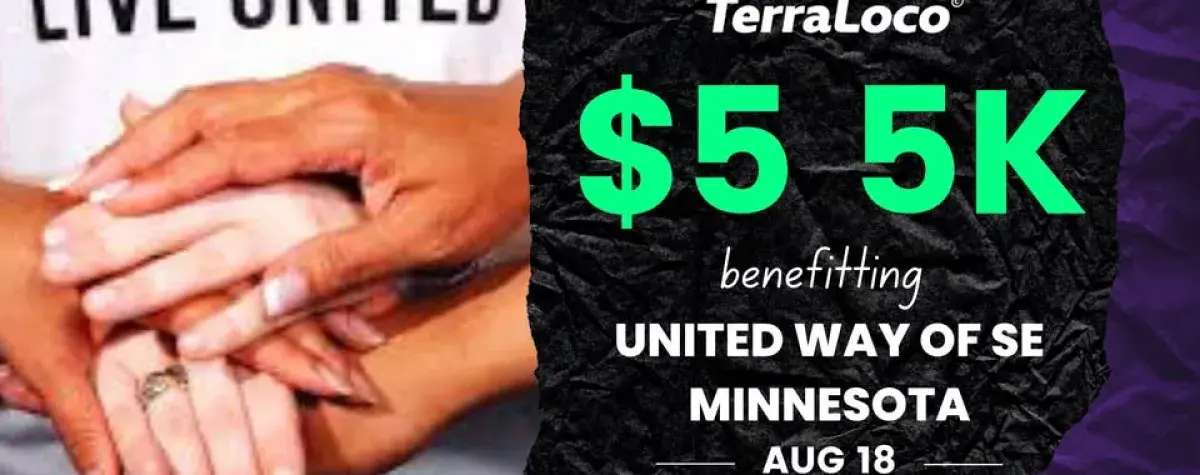 Photo of hands together in front of a Live United t-shirt