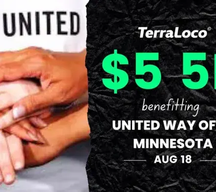Photo of hands together in front of a Live United t-shirt