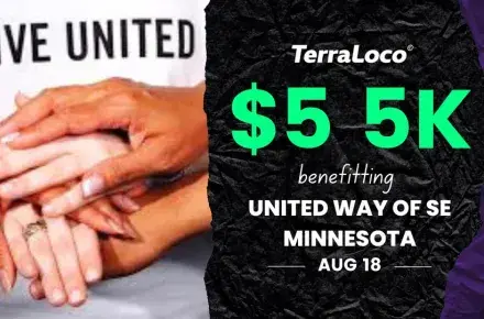 Photo of hands together in front of a Live United t-shirt